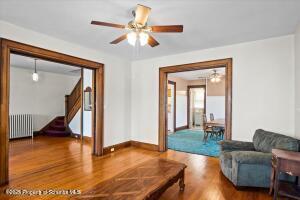 802 Madison Avenue Scranton, PA 18510 - Photo 16 of 52 a living room with fireplace furniture and a wooden floor