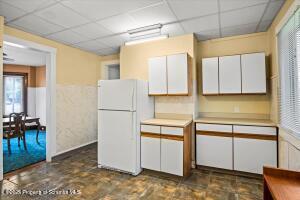802 Madison Avenue Scranton, PA 18510 - Photo 23 of 52 a kitchen with refrigerator and cabinets