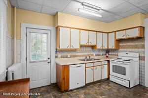 802 Madison Avenue Scranton, PA 18510 - Photo 24 of 52 a kitchen with a sink stove and cabinets