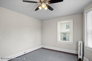 802 Madison Avenue Scranton, PA 18510 - Photo 35 of 52 an empty room with windows and fan