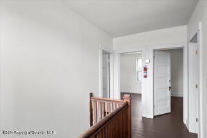 802 Madison Avenue Scranton, PA 18510 - Photo 38 of 52 a view of a hallway with wooden floor and stairs