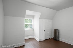 802 Madison Avenue Scranton, PA 18510 - Photo 43 of 52 an empty room with wooden floor and windows