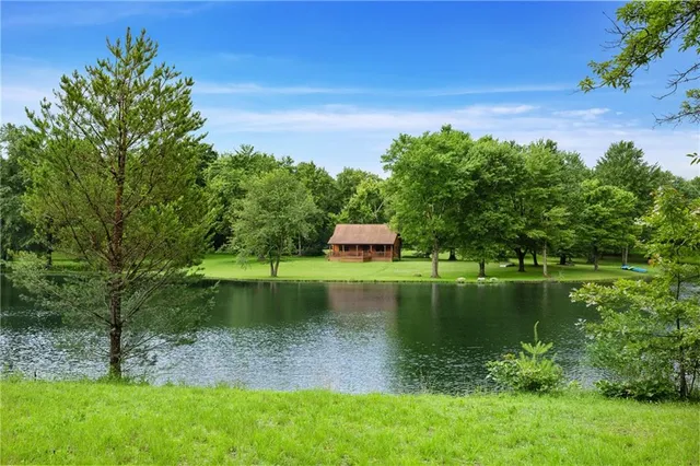 a view of a lake with a yard