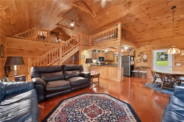 a living room with furniture and a rug