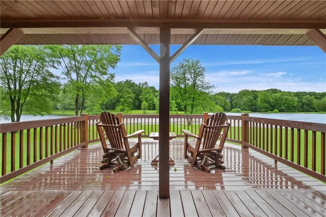 a view of a lake with a house in the background