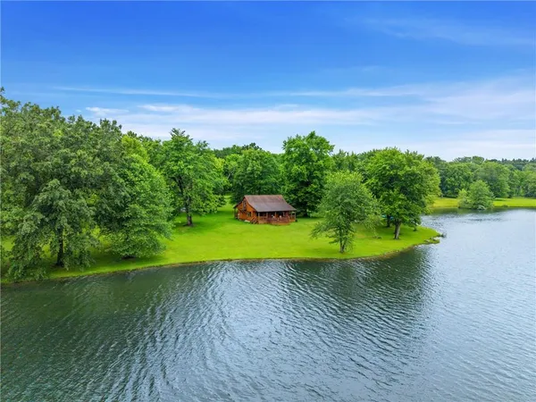 a view of a swimming pool with a yard