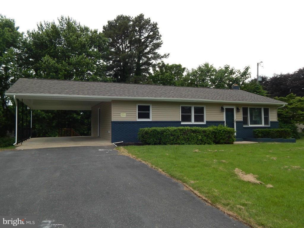 111 Calvert Towne Road Prince Frederick, MD 20678 - Photo 1 of 26 a front view of a house with yard and green space
