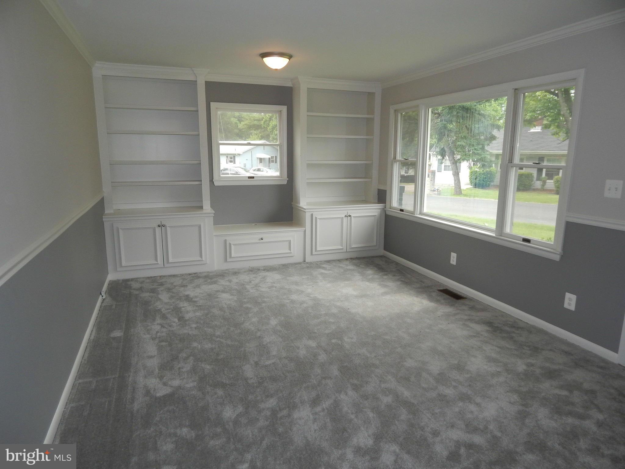111 Calvert Towne Road Prince Frederick, MD 20678 - Photo 11 of 26 an empty room with windows and cabinet