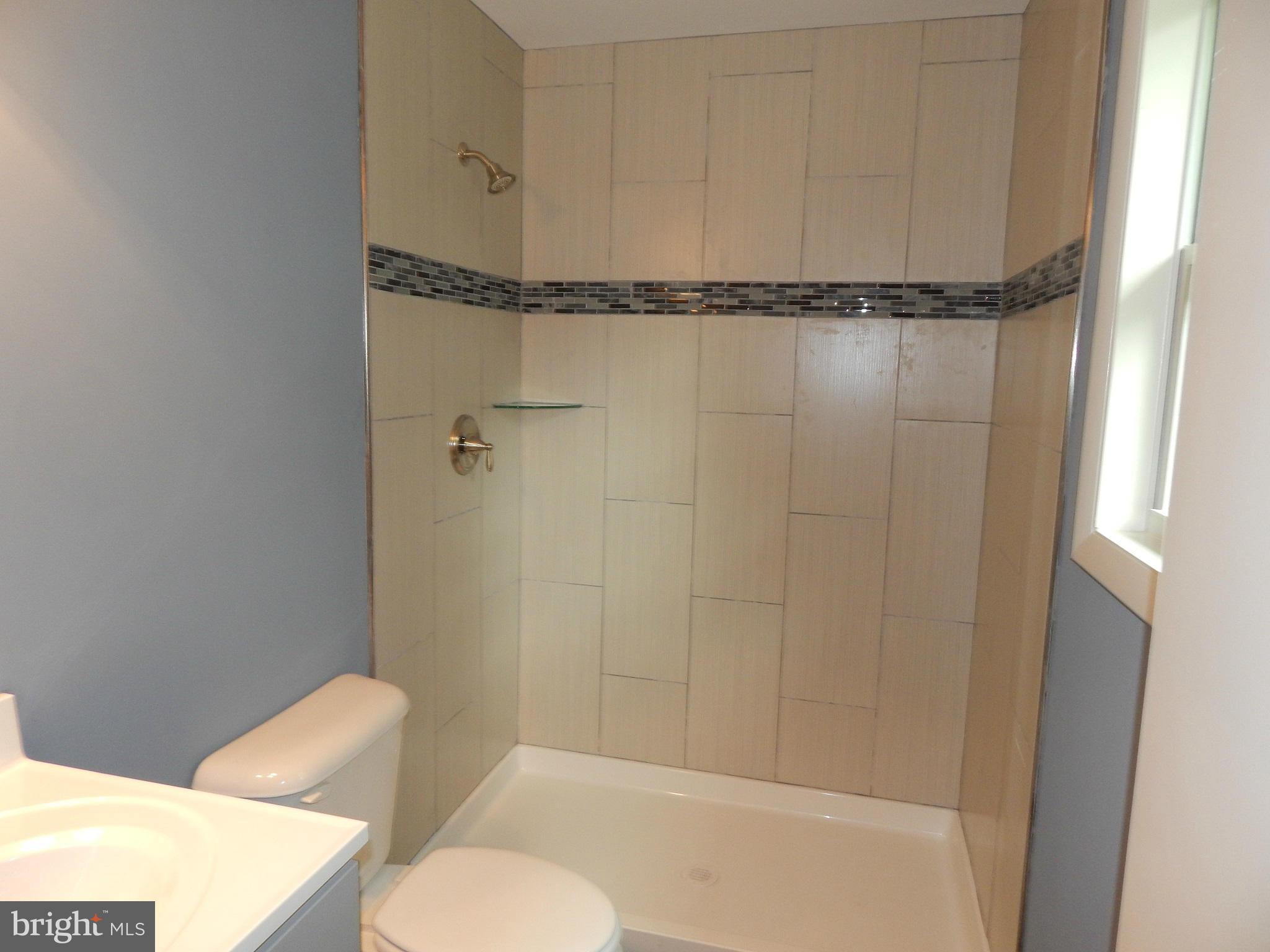 111 Calvert Towne Road Prince Frederick, MD 20678 - Photo 12 of 26 a bathroom with a shower and a toilet