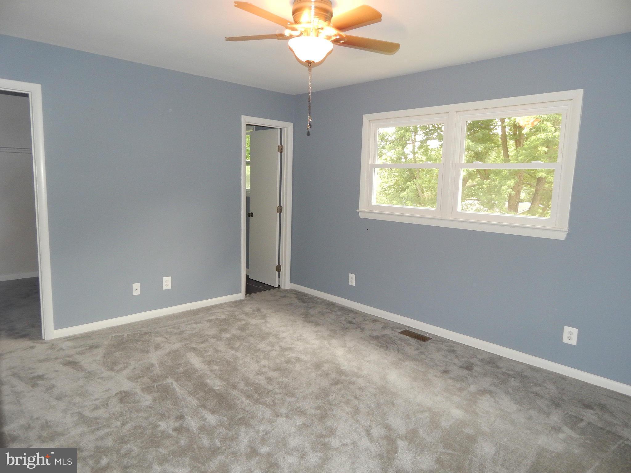 111 Calvert Towne Road Prince Frederick, MD 20678 - Photo 15 of 26 a view of an empty room with a window
