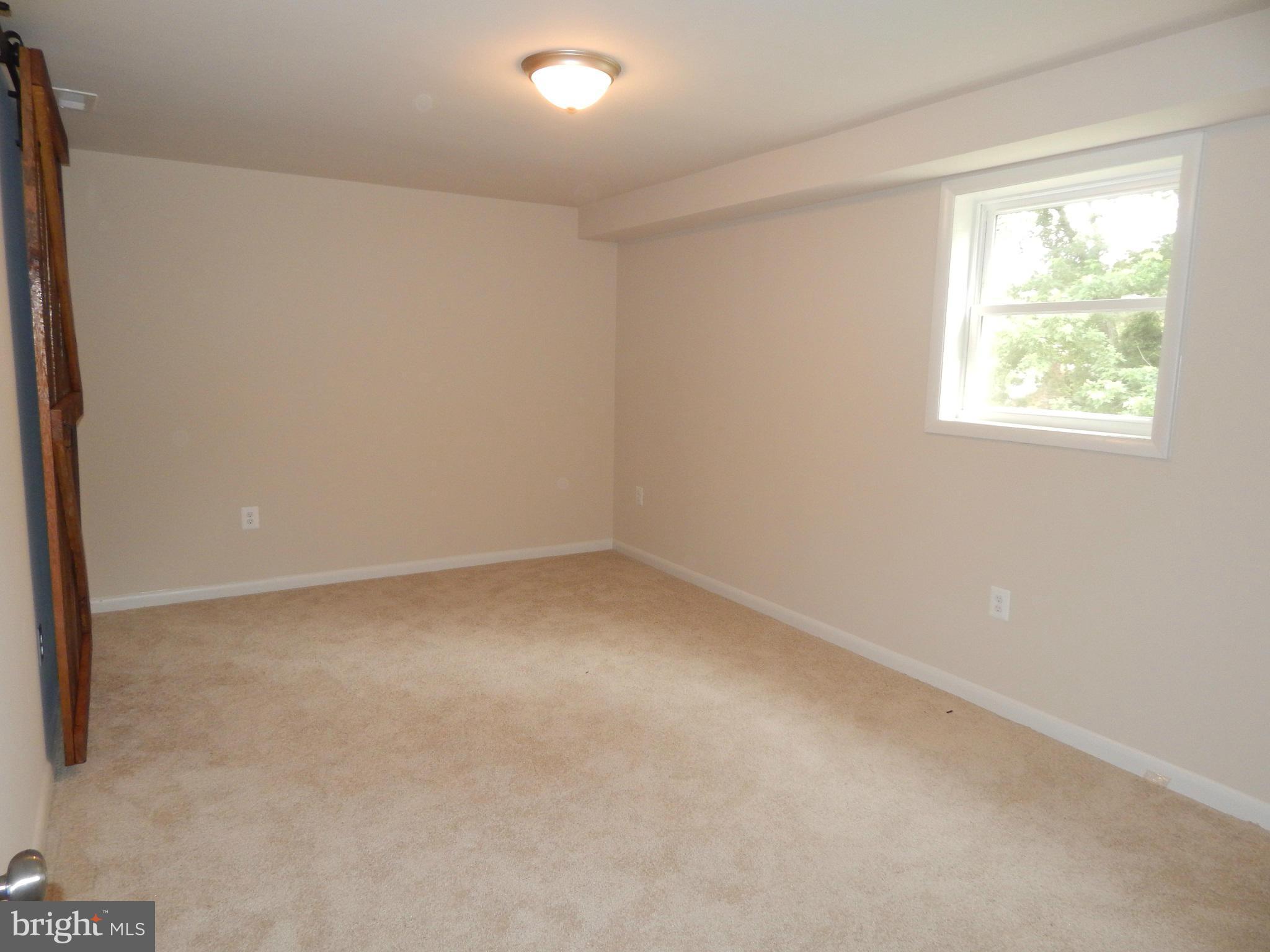 111 Calvert Towne Road Prince Frederick, MD 20678 - Photo 17 of 26 an empty room with a window