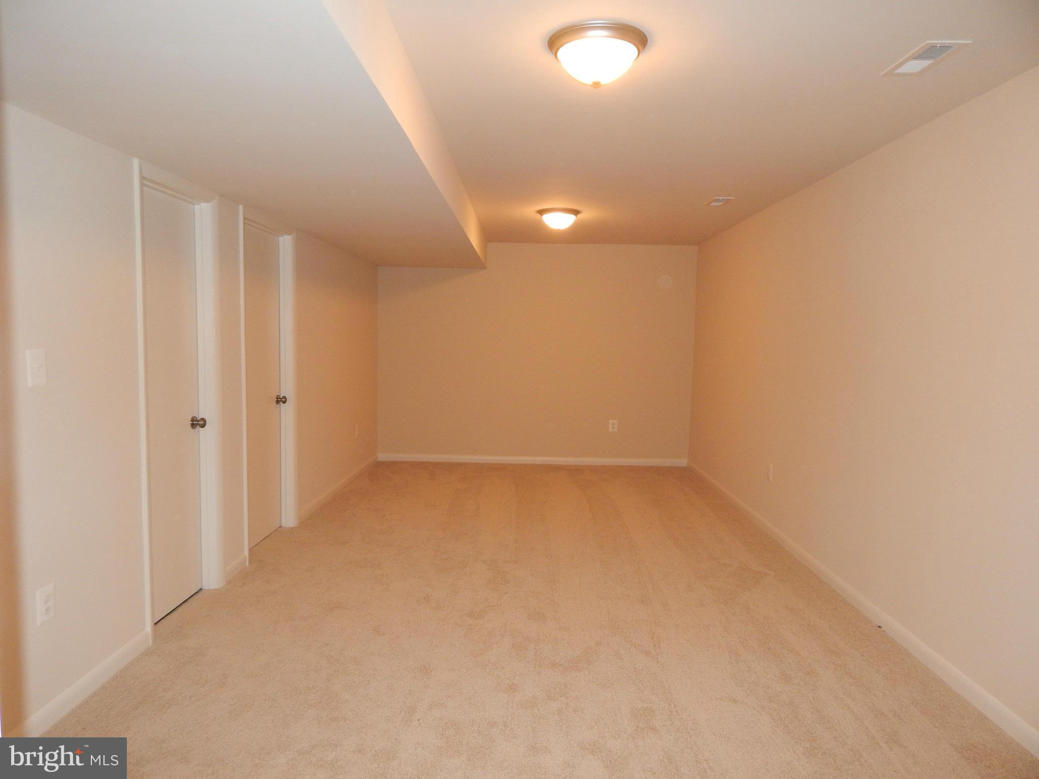 111 Calvert Towne Road Prince Frederick, MD 20678 - Photo 18 of 26 an empty room with a empty space and windows
