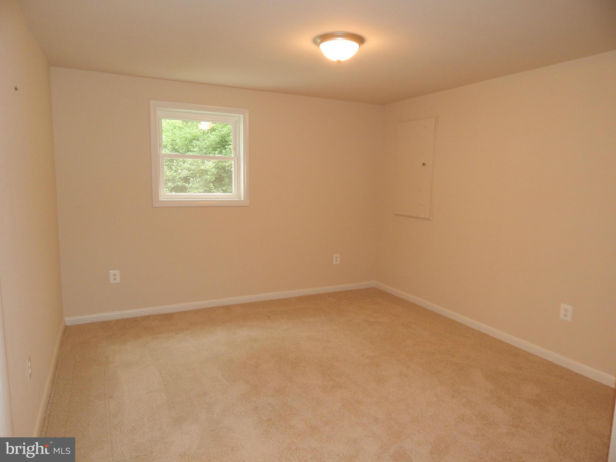 111 Calvert Towne Road Prince Frederick, MD 20678 - Photo 21 of 26 an empty room with a window