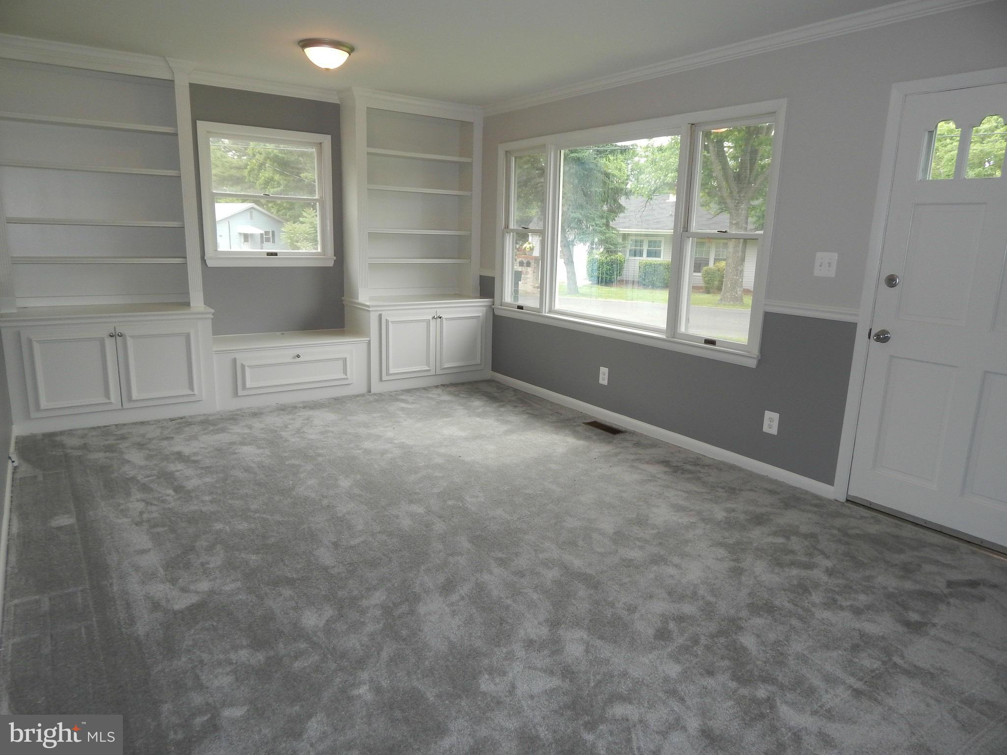 111 Calvert Towne Road Prince Frederick, MD 20678 - Photo 10 of 26 a view of an empty room with a window