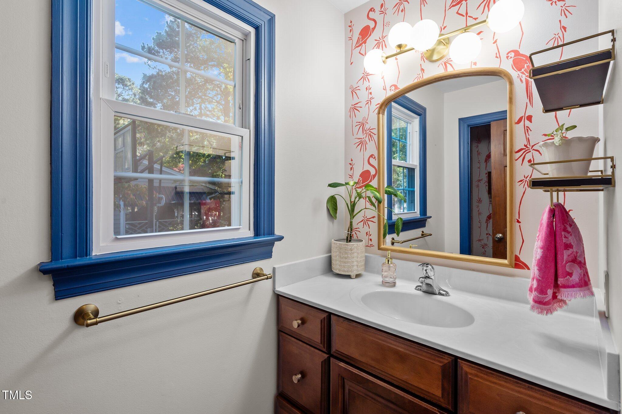 2916 Bolo Trail Raleigh, NC 27615 - Photo 15 of 43 a bathroom with a sink and a mirror