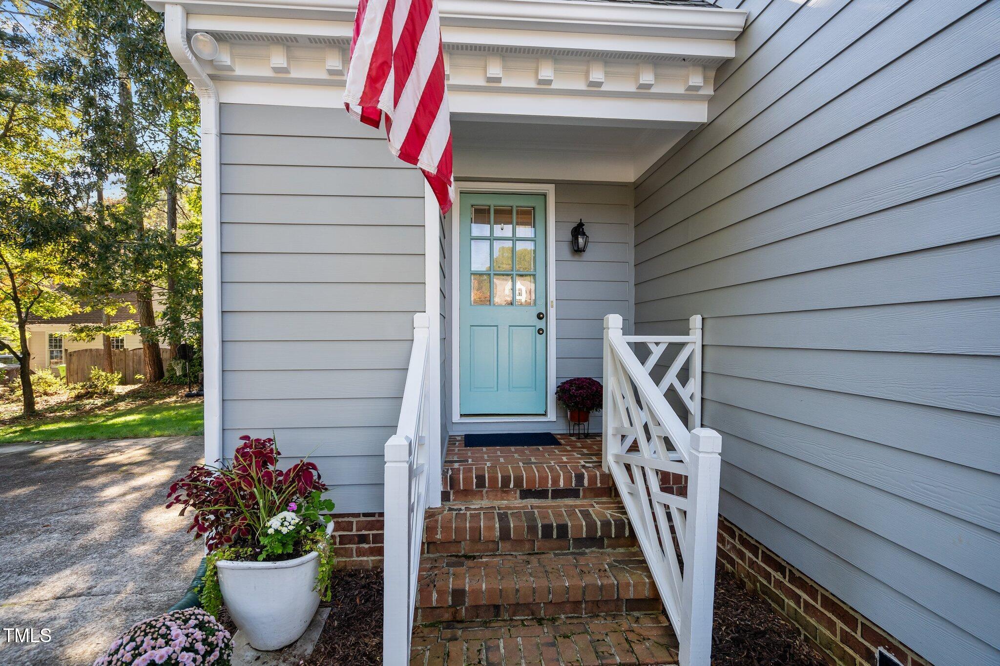 2916 Bolo Trail Raleigh, NC 27615 - Photo 31 of 43 a view of a house with a potted plant and stairs