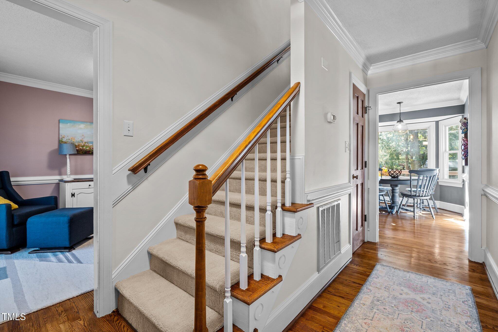 2916 Bolo Trail Raleigh, NC 27615 - Photo 4 of 43 a view of entryway and hall with wooden floor