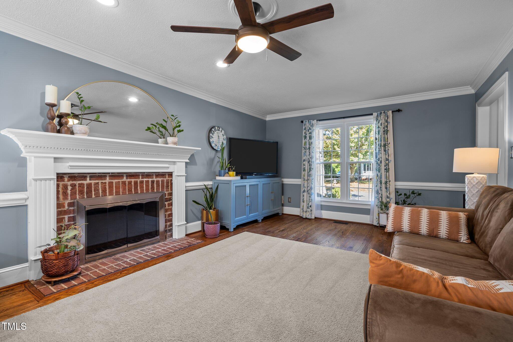 2916 Bolo Trail Raleigh, NC 27615 - Photo 6 of 43 a living room with furniture and a fireplace