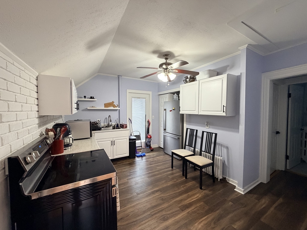 341 Linwood Avenue, Unit 2 Newton, MA 02460 - Photo 3 of 18 a kitchen that has a lot of cabinets a sink and appliances in it