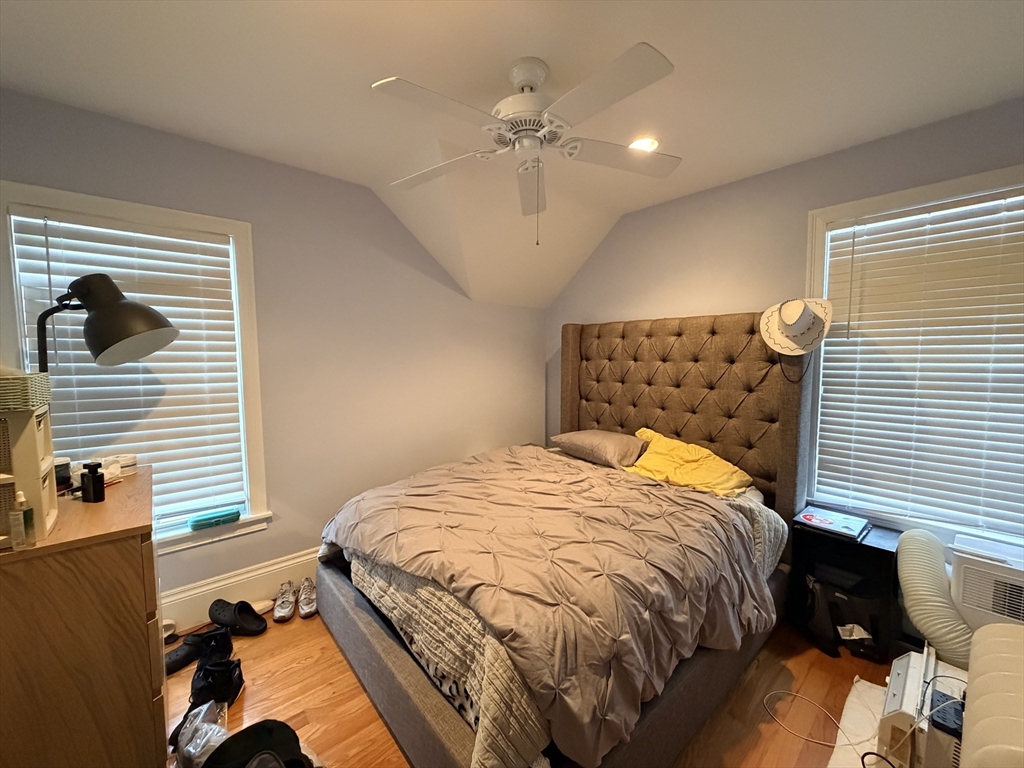 341 Linwood Avenue, Unit 2 Newton, MA 02460 - Photo 7 of 18 a bed sitting in a bedroom next to a window