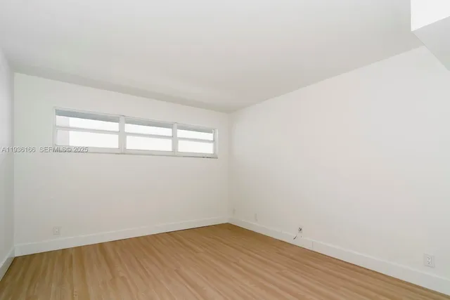 a view of a room with washer and dryer