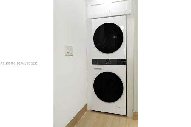 a view of a balcony with wooden floor and fence