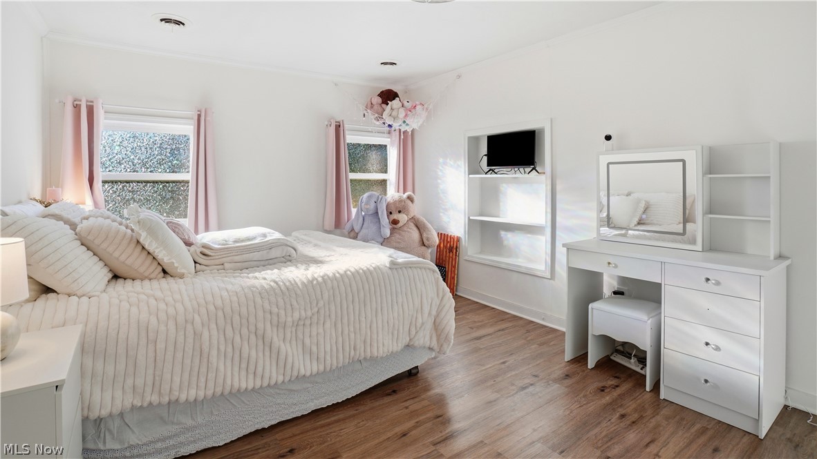 65892 Endley Road Cambridge, OH 43725 - Photo 24 of 50 Bedroom featuring multiple windows and wood finished floors