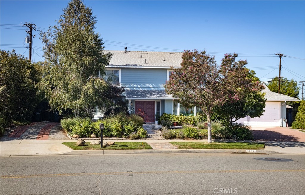 1502 Marion Road Redlands, CA 92374 - Photo 1 of 1 a view of a house with a garden and plants