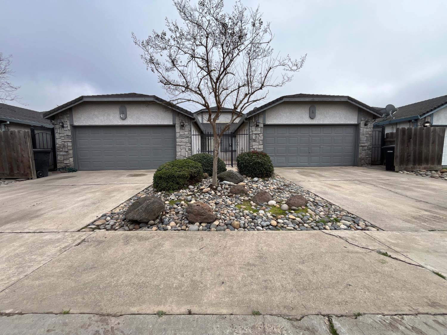 Looking east... Low maintenance, yet attractive entry. Secure iron gates at entry and side yards.