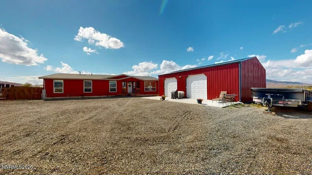 a view of a house with backyard and porch
