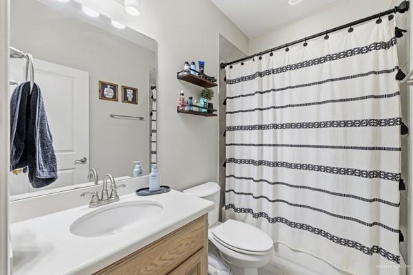 14126 Wichita Falls Lane McAllen, TX 78504 - Photo 11 of 14 a bathroom with a sink toilet and shower