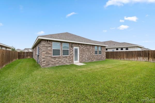 14126 Wichita Falls Lane McAllen, TX 78504 - Photo 13 of 14 a front view of a house with a garden
