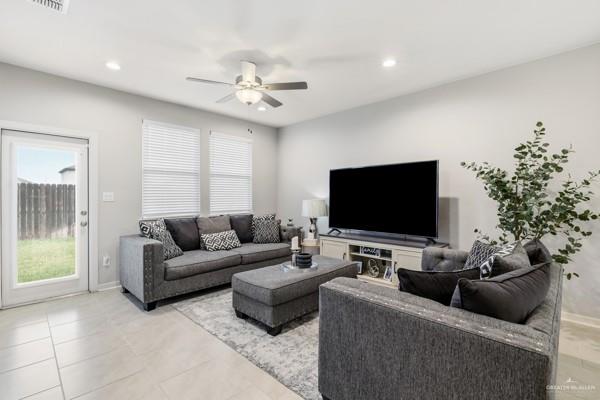 14126 Wichita Falls Lane McAllen, TX 78504 - Photo 3 of 14 a living room with furniture and a flat screen tv
