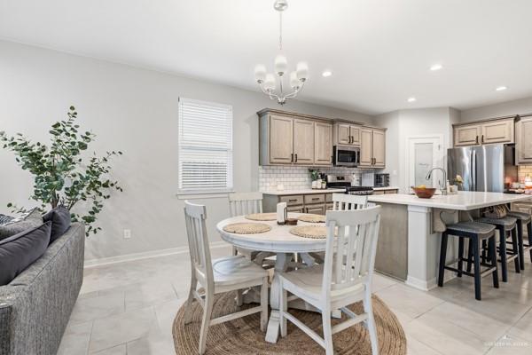 14126 Wichita Falls Lane McAllen, TX 78504 - Photo 4 of 14 a kitchen with a table and chairs in it