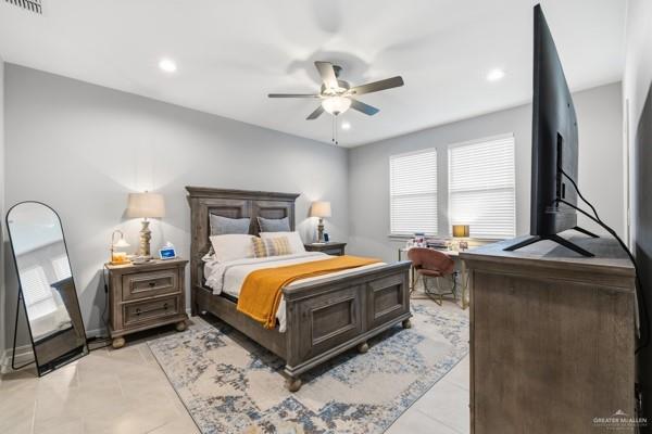 14126 Wichita Falls Lane McAllen, TX 78504 - Photo 6 of 14 a bedroom with a bed a table and painting on the wall