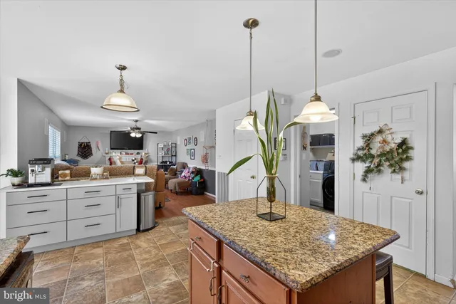 a view of kitchen center island and living room