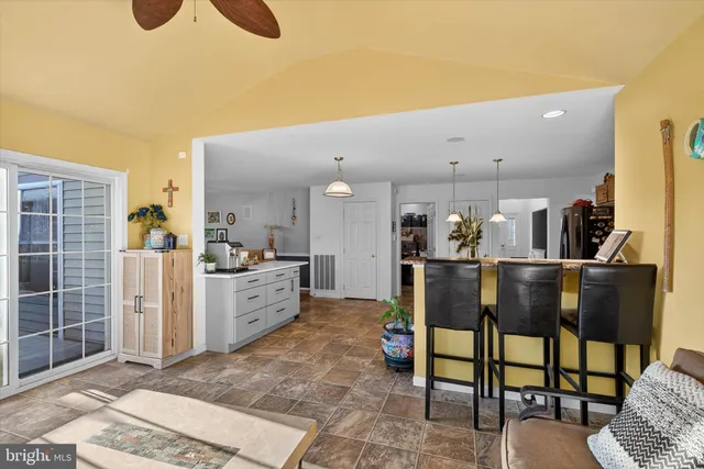 a kitchen with furniture and window