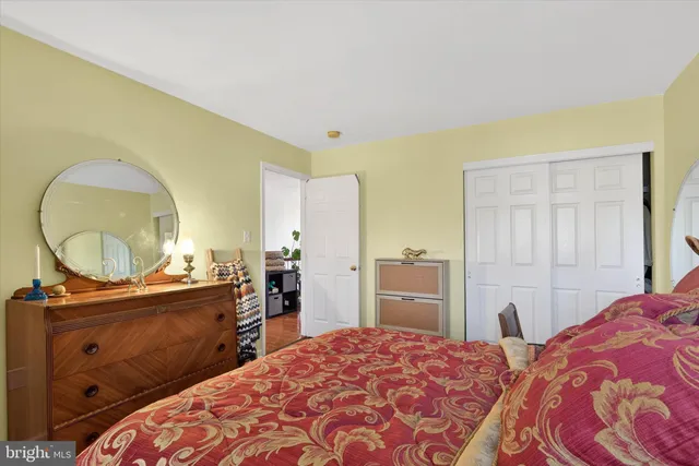 a bedroom with a bed and a dresser