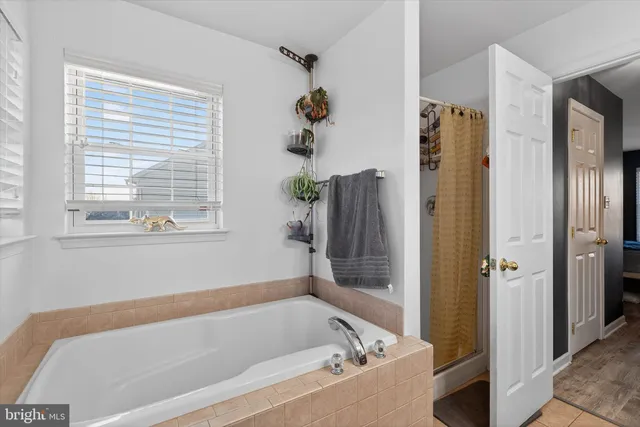 a bath tub sitting next to a window