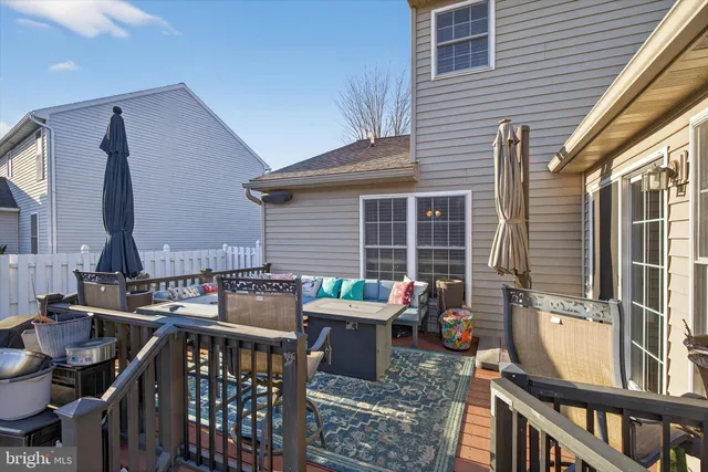 a view of a patio with couple of chairs