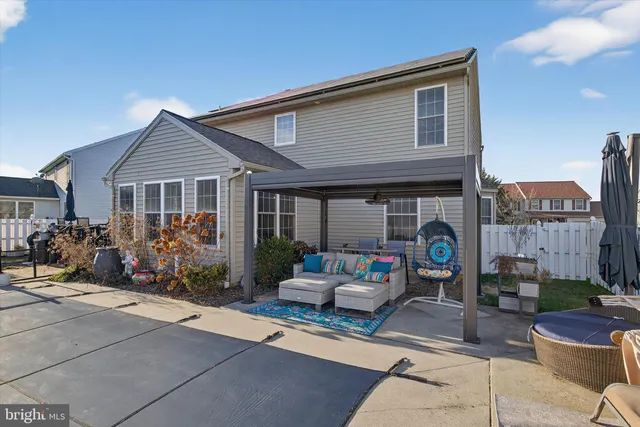 a view of a patio with couches table and chairs