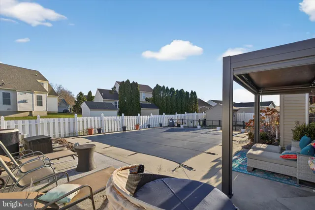 a front view of a house with sitting area