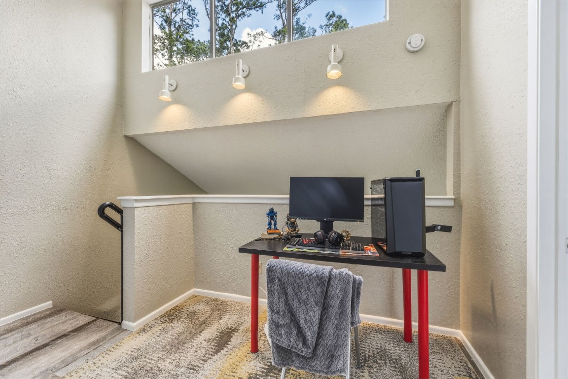 12900 Walden Road, Unit 312C Montgomery, TX 77356 - Photo 18 of 26 Windows along lofted ceiling with views of trees and southeasterly light