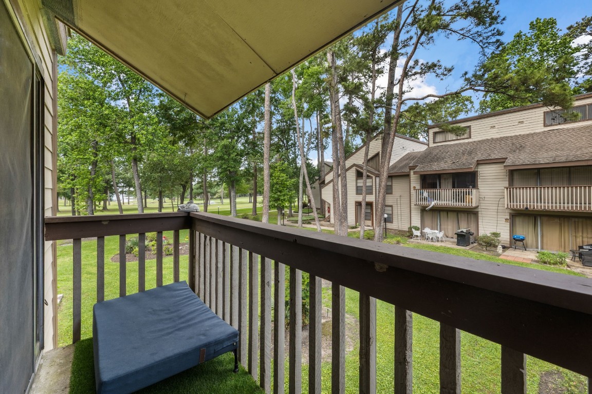 12900 Walden Road, Unit 312C Montgomery, TX 77356 - Photo 22 of 26 Balcony looking out toward golf course and Lake Conroe
