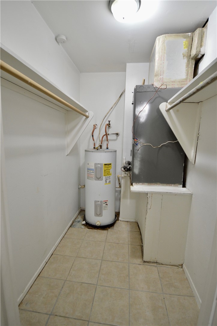 1004 Austin Street, Unit 3 Portland, TX 78374 - Photo 11 of 12 a view of water heater room with a window