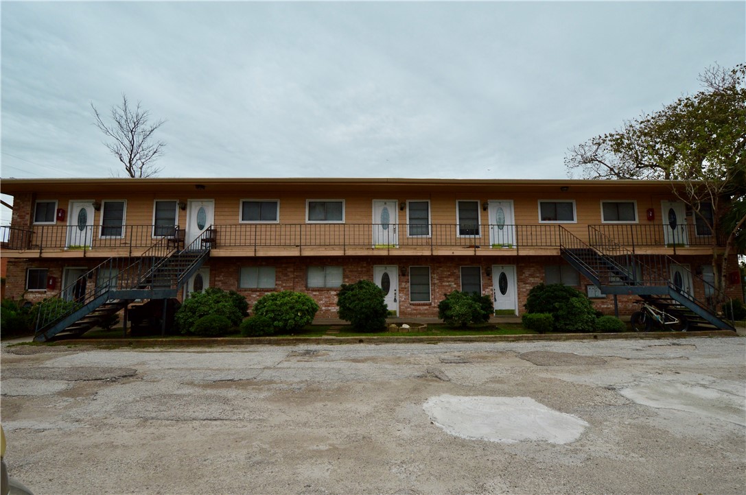 1004 Austin Street, Unit 3 Portland, TX 78374 - Photo 2 of 12 a front view of a house with a yard