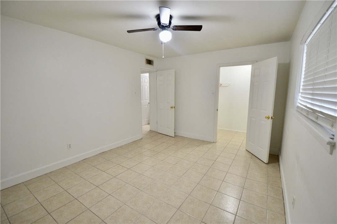 1004 Austin Street, Unit 3 Portland, TX 78374 - Photo 8 of 12 a view of a livingroom with a ceiling fan and window