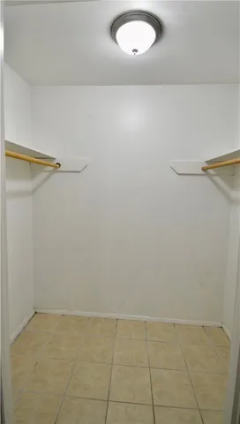 an empty room with a bench