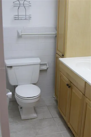 a bathroom with a toilet and a sink