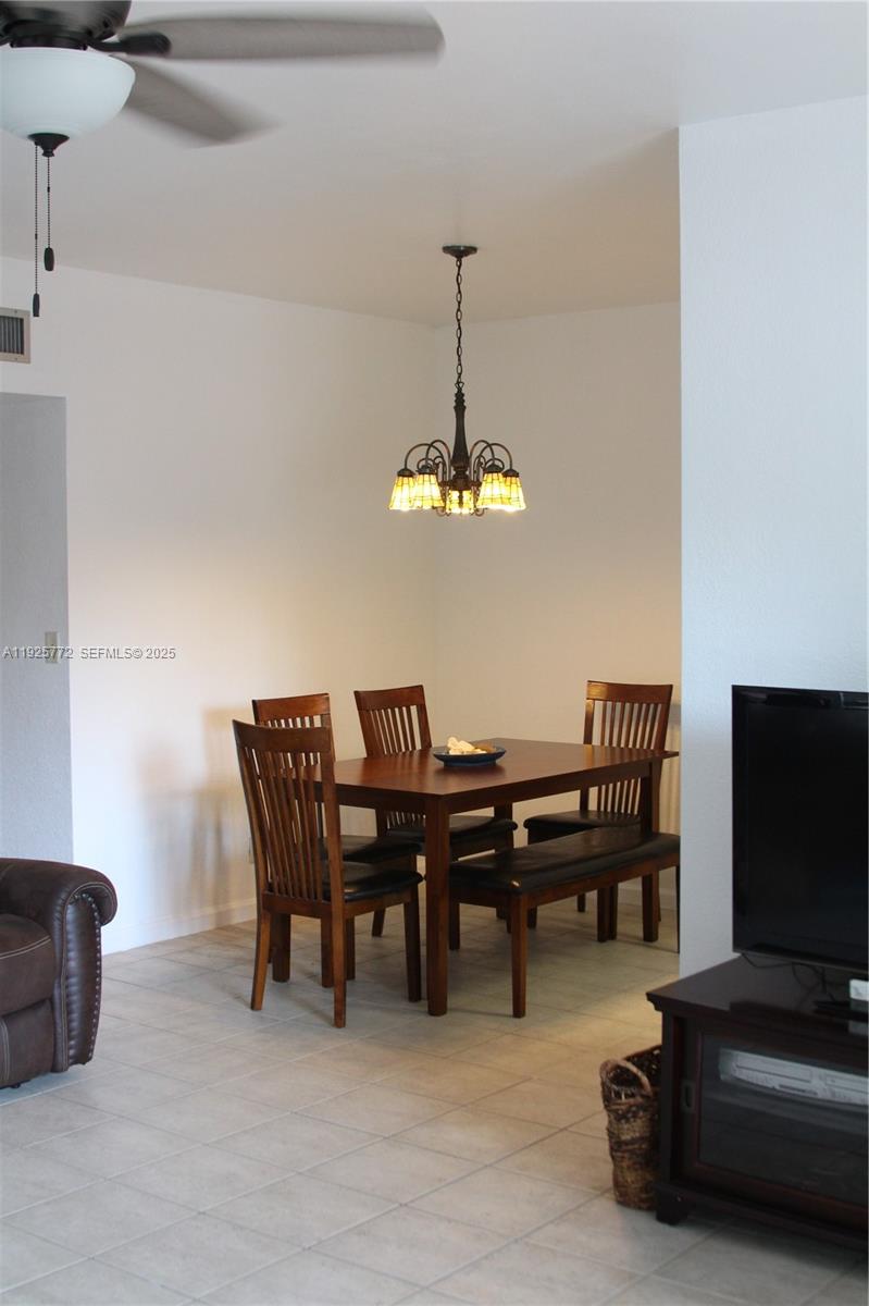 1300 North Ocean Boulevard, Unit 111 Pompano Beach, FL 33062 - Photo 20 of 26 a view of a dining room with furniture